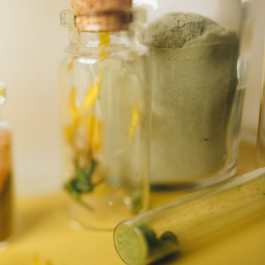Herbal powder in a glass container